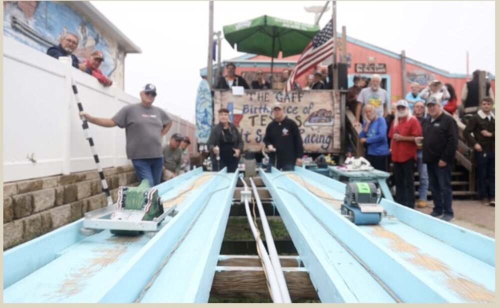 Belt sander races at The Gaff — a Port Aransas local tradition where modified belt sanders race down a wooden track